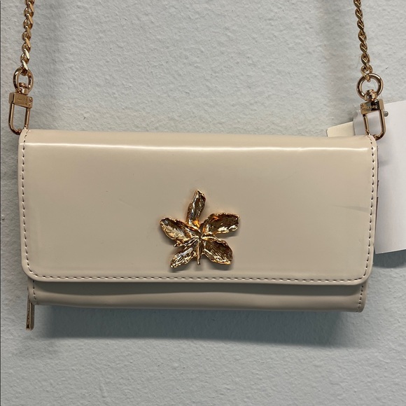 Anne Klein Handbags - Anne Klein | Cream Clutch w/Gold Floral Accent ✨
